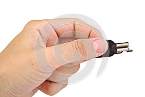 Hand holding a security key isolated on a white