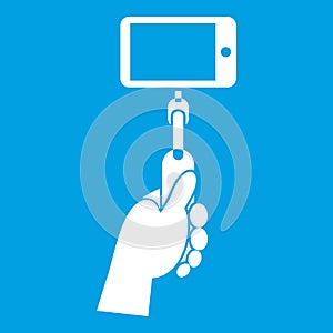 Hand holding a selfie stick with mobile phone icon