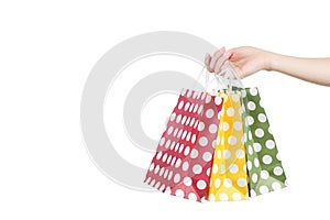 Hand holding shopping bags