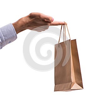 Hand holding shopping bags with christmas shopping on white back