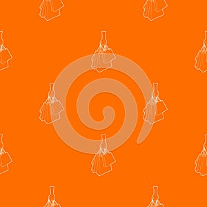 A hand holding shopping bags pattern vector orange