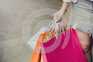 Hand on holding shopping bags , she walking shopping