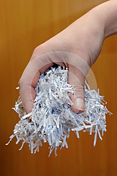 Hand holding shredded paper 3