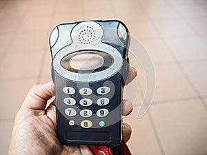 Hand holding a audioguide