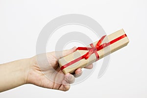 Hand holding small red present box in hands
