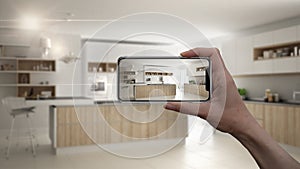 Hand holding smart phone, AR application, simulate furniture and interior design products in real home, architect designer concept photo