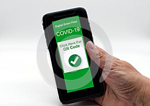 Hand holding a smartphone with Digital Green Pass on display, ready to get the QR code