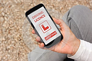 Hand holding smartphone with driving licence application mock up