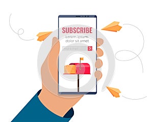 Hand holding smartphone with email subscription form on screen. Mobile subscribe on newsletter or online service. Paper