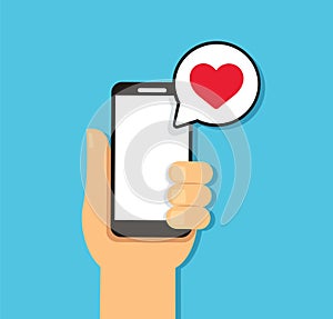 Hand holding smartphone with heart bubble chat