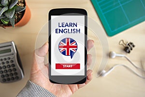 Hand holding smartphone with online learn English concept on screen