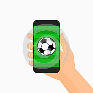 Hand holding smartphone with soccer ball on the screen