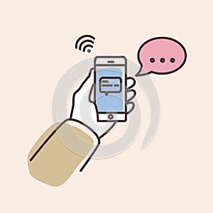 Hand holding smartphone with text message on screen and speech bubble. Phone with chat or messenger notification