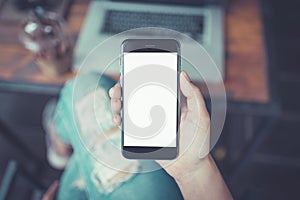 Hand holding smartphone white screen.