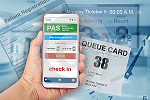 Hand holding smartphont showing electronic queueing application