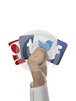 Hand holding social media icons