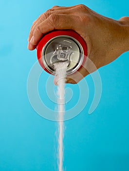 Can pouring sugar stream in calories content of soda energetic and refreshing drinks