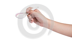 Hand holding soup spoon isolated on white background.