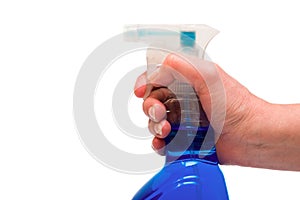 Hand holding spray bottle