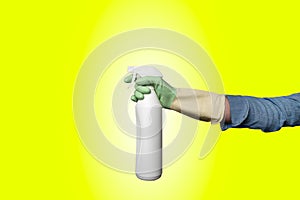 Hand holding spray bottle with gloves for insect extermination or windows cleaning