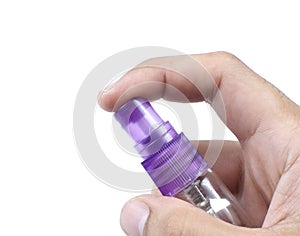 Hand holding a spray