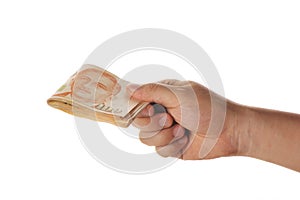 Hand holding a stack of singapore dollars