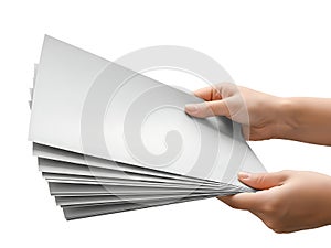 Hand holding a stack of white paper sheets