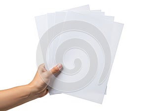 Hand holding a stack of white paper sheets