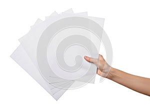 Hand holding a stack of white printer paper
