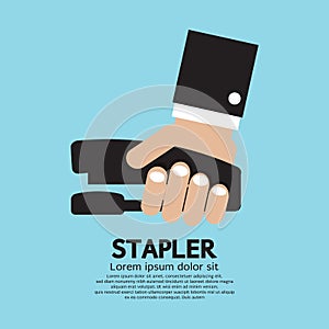 Hand Holding A Stapler photo