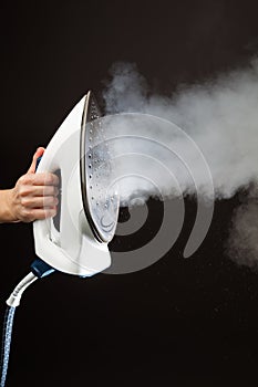 Hand holding steam generator iron