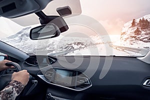 Hand holding steering wheel in luxury private car, Driving in ru