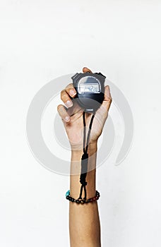 Hand holding stop watch isolated on white background