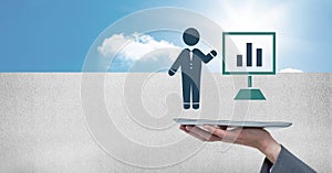 Hand holding tablet with businessman icon presenting chart screen