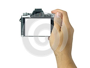 Hand holding and taking shot blank display mirrorless camera isolated