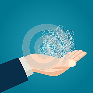 Hand holding tangled thread