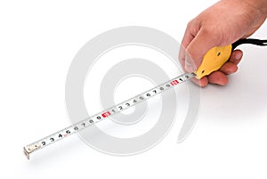 Hand holding a tape measure
