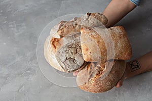 Hand holding tasty fresh bread,