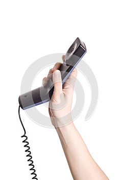 Hand holding telephone receiver