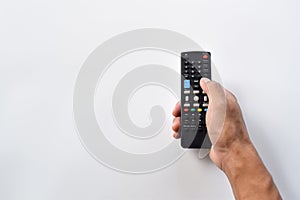 Hand holding television remote control