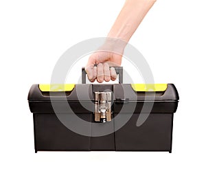 Hand holding toolbox