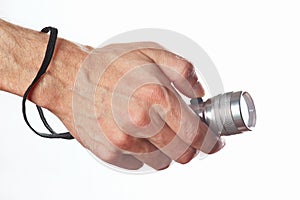 Hand holding a torch on white background