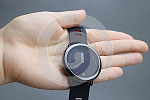 Hand holding Touch smartwatch with round display