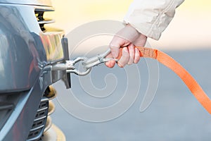 Hand holding tow rope