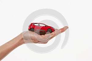 Hand holding toy car