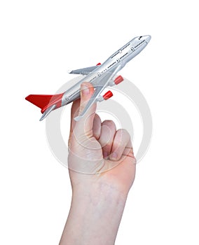 Hand holding the toy plane