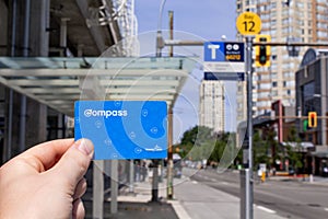 Hand holding a Translink Compass Card