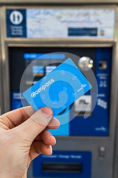 Hand holding a Translink Compass Card