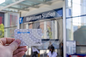 Hand holding a Translink Compass Card