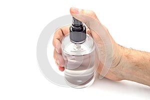 Hand holding transparent spray can